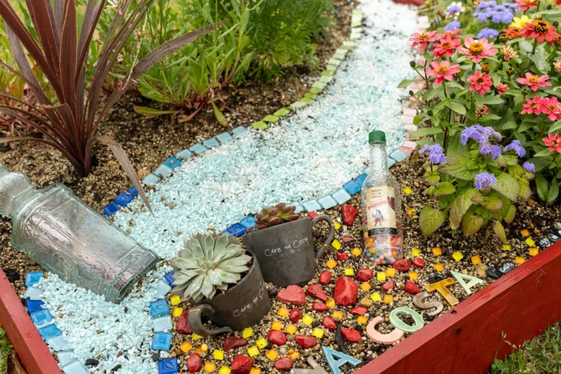 Create A Vertical Garden Using Upcycled Plastic Bottles And Repurposed Pallets