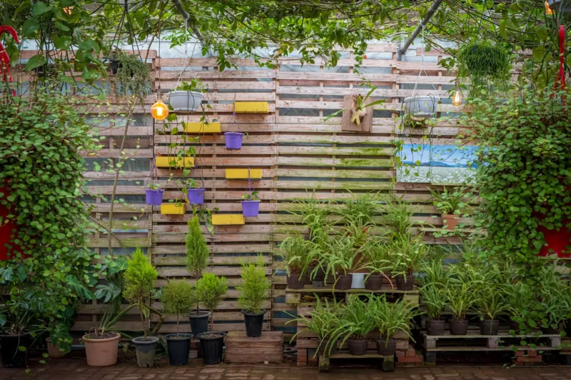 Create A Vertical Garden Wall Using Reclaimed Pallets And Drip Irrigation System